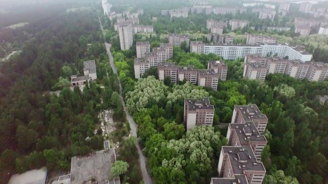 Aerial view of Pripyat, Ukraine, abandoned after Chernobyl. Nature reclaims city structures.