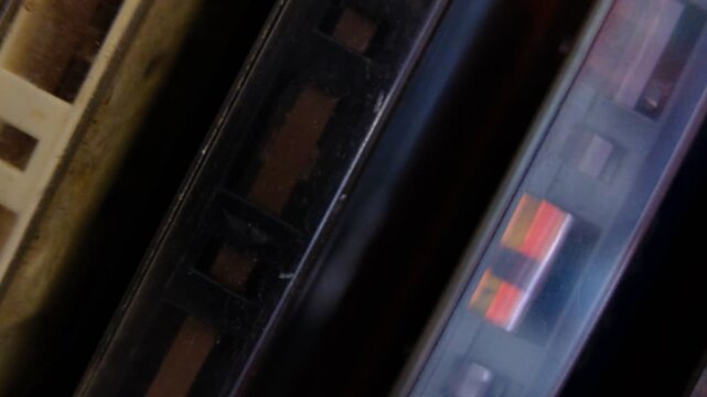 vintage retro audio tape cassettes on a rotating table with a dark background