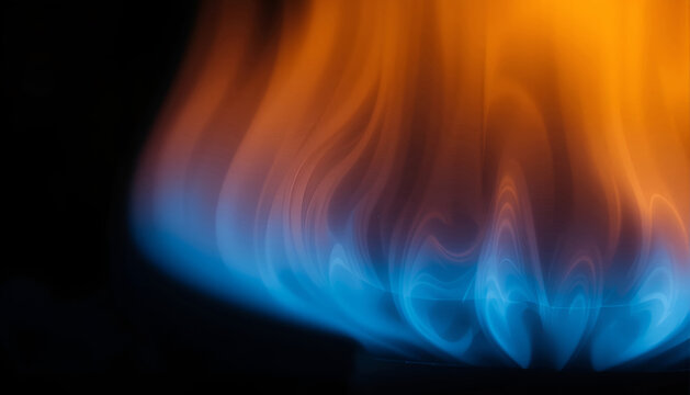 Blue and orange flames dancing against a dark background, showcasing the vibrant colors and fluid motion of fire in a close-up view