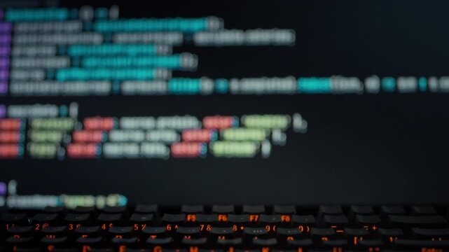 A programmer observes as a computer display dynamically generates precise algorithmic code, highlighting autonomous programming and technological innovation in automation software