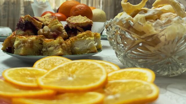 Close-up of Festive Eid Table with Lemon, Sweets, Tea and Homemade Pies