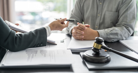 Lawyer Legal counsel presents to the client a signed contract with gavel and legal law. justice and...