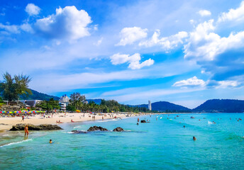 Tropical Patong Kamala Beach Phuket Thailand tourists people parasol palm. © Arkadi