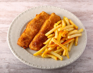 battered and fried fish and potatoes