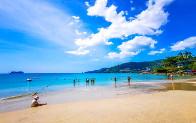 Fototapeta premium Tropical Patong Kamala Beach Phuket Thailand tourists people parasol palm.