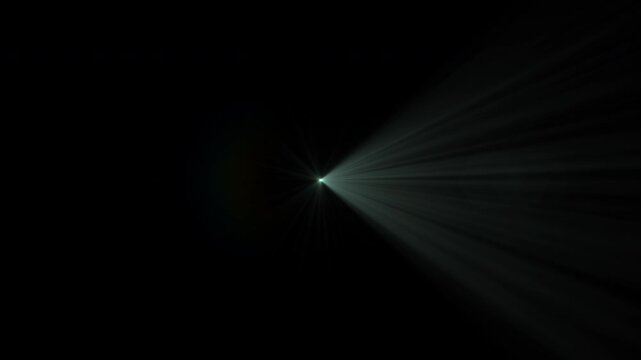 Central Bright Light Searching from Right to Left with Volumetric Rays on Black Background. Use add or screen modes to remove background and overlay on your videos.