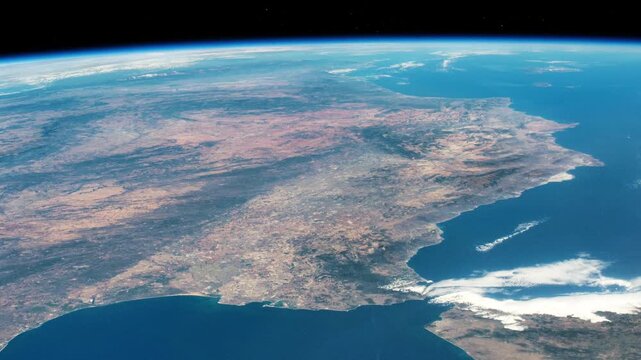 Flying over Spain and Strait of Gibraltar with Earth curved horizon satellite view from space based on Nasa imagery