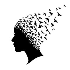 A black silhouette of a woman with birds flying out of her head