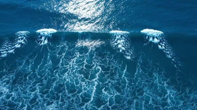Ocean waves with sunlight reflection on surface