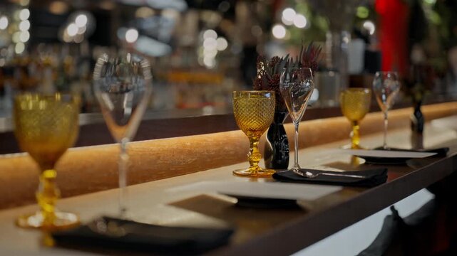A clean glass goblet. Beautiful clean glasses in a bar and restaurant. Thin glass goblet. Elegant look. Light reflection in a glass goblet.
