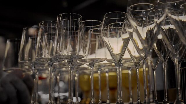 A clean glass goblet. Beautiful clean glasses in a bar and restaurant. Thin glass goblet. Elegant look. Light reflection in a glass goblet.