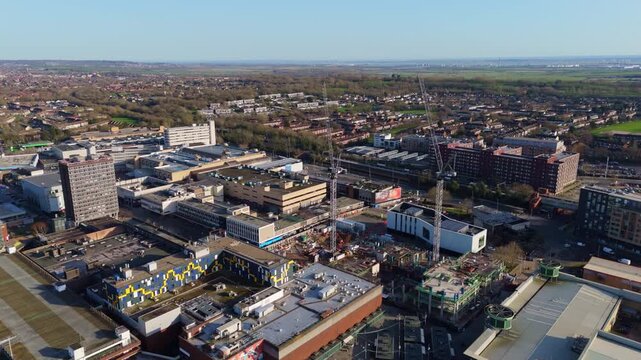 An aerial view of Basildon, UK, shows construction, buildings and urban sprawl