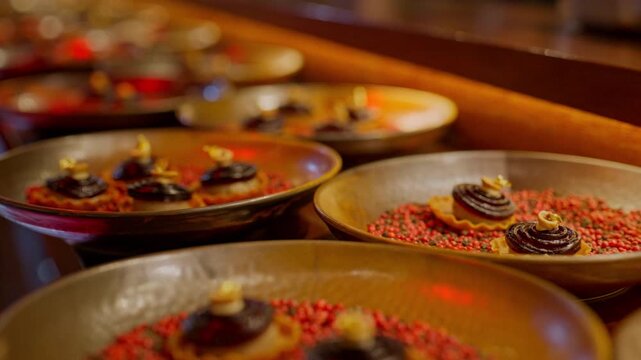 A gourmet dinner at a restaurant. Gastronomic food and dishes. Decorations and sophistication of signature dishes from the chef. Food as art. Bright colors of the dishes.