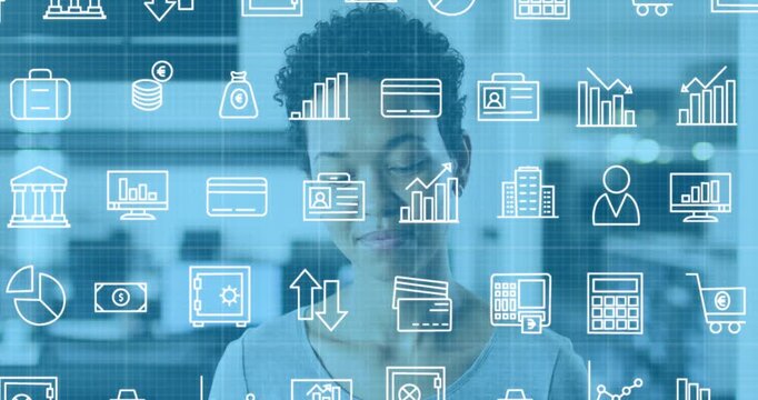 Animation of financial icons over woman smiling at camera in office