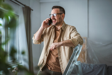 Man talking on phone discussing home renovation plan