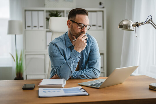Man thinking about work problem, planning business strategy