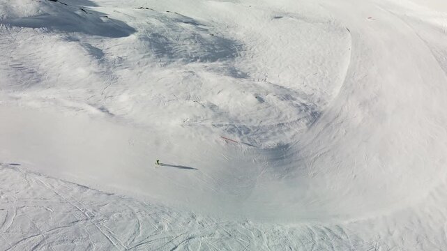 Skier on a narrow slope - Top down aerial footage