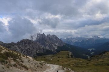 Alpine ridges of the Dolomites with clouds drifting above