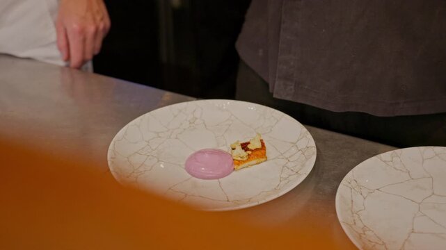 A gourmet dinner at a restaurant. Gastronomic food and dishes. Decorations and sophistication of signature dishes from the chef. Food as art. Bright colors of the dishes.