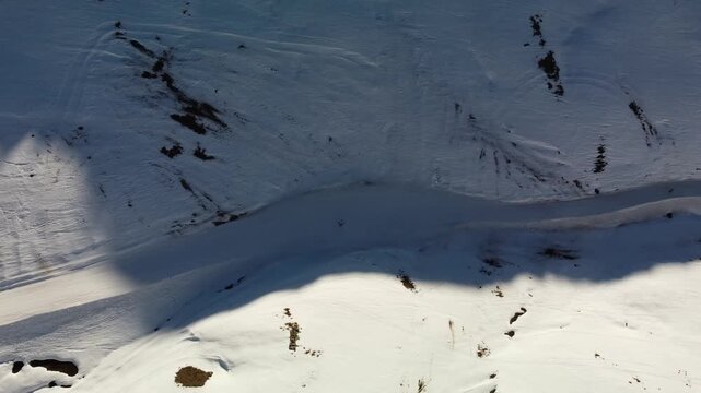 Skier on a narrow slope - Top down aerial footage