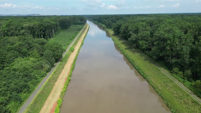 High altitude aerial view following the Morava River towards Kromeriz, scenic river landscape in Czech Republic