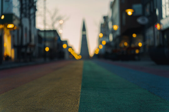 Low angle perspective of the colorful Rainbow Street at dawn in Reykjavik.