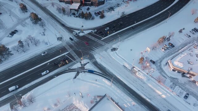Snowy aerial view of Derry Rd intersection, Mississauga in winter
