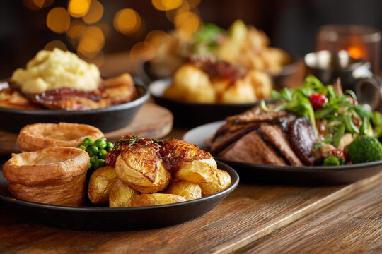 A mouthwatering spread of traditional British Sunday roast dinner on a wooden table