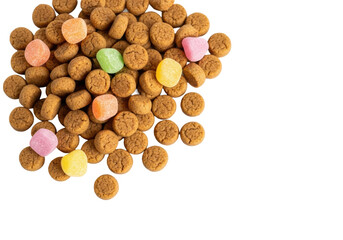 Traditional Dutch kruidnoten and pastel candies, scattered on white studio background, copy space, soft light, sharp focus, Sinterklaas festive treat concept.