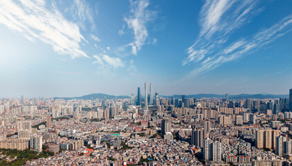 Obraz premium Panoramic skyline of Guangzhou with skyscrapers and blue sky, aerial photo of China for travel