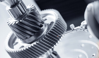 Naklejka premium Cnc coordinate measuring machine analyzing metal gear for precision engineering