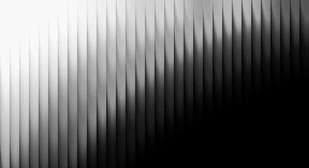 Obraz premium Black and white gradient strip showing smooth transition from light to dark in progressive steps and segments