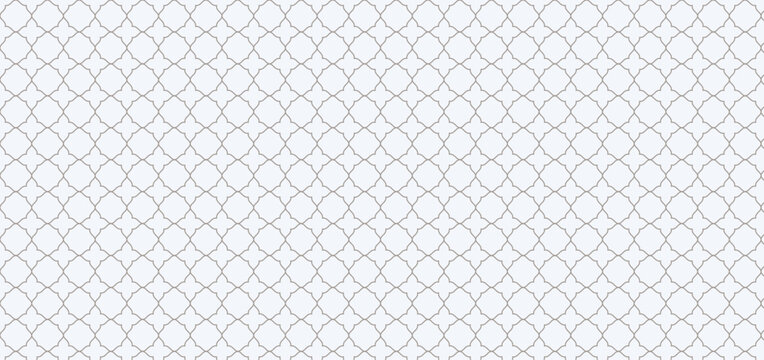 Elegant seamless grey quatrefoil geometric pattern on a clean white background for modern interior design