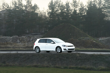 Naklejka premium Low-cost hatchback vehicle under sunlight