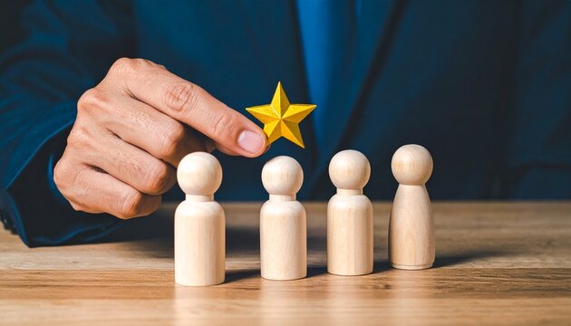 Business Professional Holding a Golden Star Over a Selected Wooden Figure for Employee Recognition