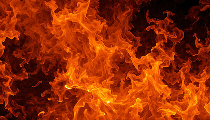Vibrant orange flames burning intensely in darkness