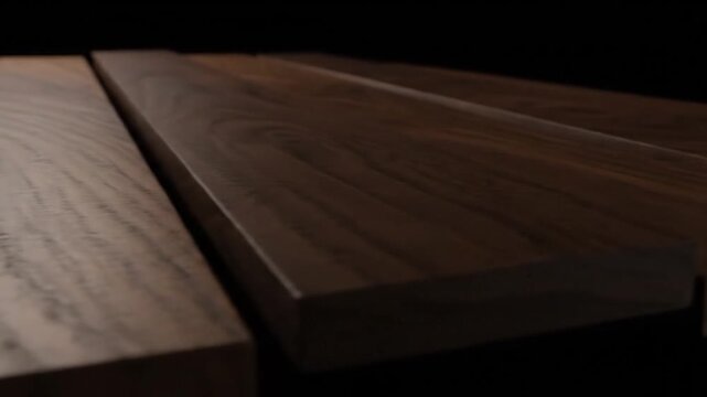 Close-up of three wooden planks, with grain visible and a dark background