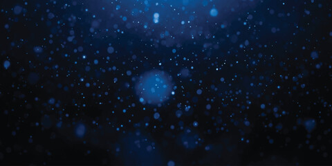 Abstract dark blue background with glowing particles and bokeh effect creating a sense of depth © md