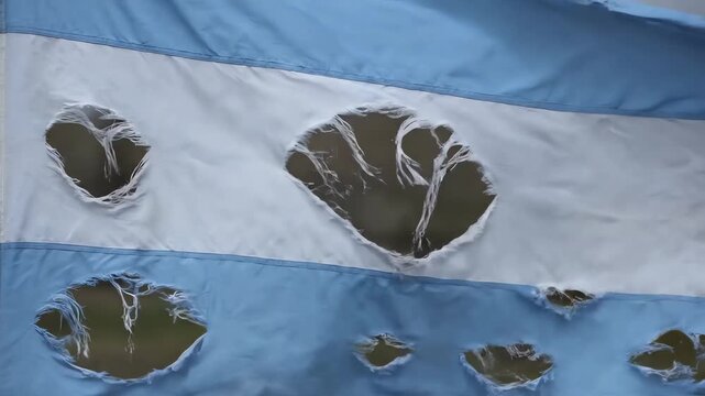 Torn Tattered Blue and White Striped Flag Waving in Gentle Breeze