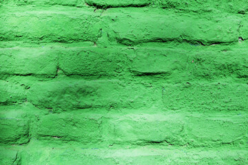 Vibrant, textured green brick wall painted unevenly.  © Nataly Regina