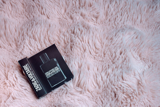 Sollentuna, Sweden, February 8, 2026: Photo of a sample of Zadig & Voltaire's This Is Him fragrance against a soft pink faux fur background, close-up of the fragrance.