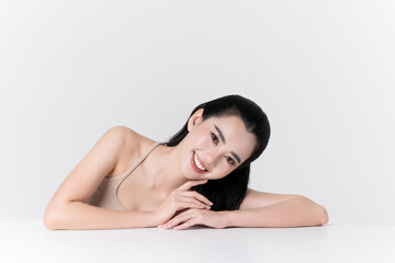 Obraz premium Beautiful portrait of young asian woman with healthy facial and body skin, healthy hair, care teeth and glowing natural makeup for advertise skincare product, wellness, self care and cosmetics concept