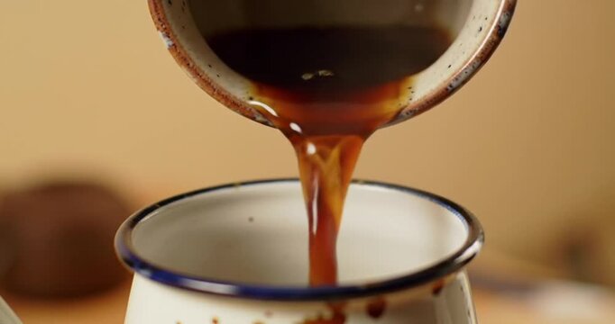 Coffee pouring into a cup.