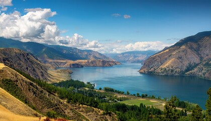 Fototapeta premium scenic panorama of lake chelan washington state usa from high angle view with mountains and clouds on a sunny day in the pacific northwest
