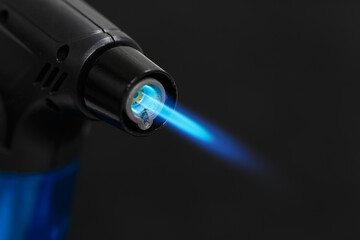 Gas lighter with flame close-up