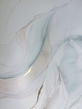 Abstract pale green hand made aquarelle background with beige. Beautiful watercolor artwork made with alcohol ink. Light green smoky fluid art texture resembles green mist, marble, water, ocean, flow.