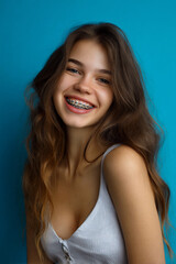 Naklejka premium bright teenage girl smiling with braces, cheerful young female portrait outdoors, radiant happy teenager with perfect smile