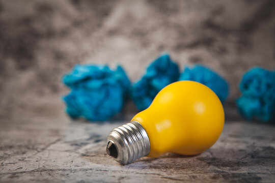 light bulb and colorful crumpled paper ball