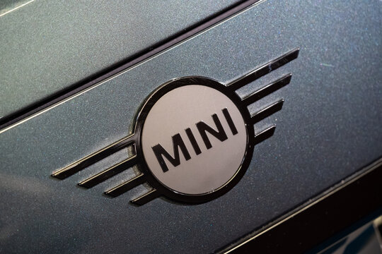 Close up of MINI Cooper logo on metallic car body. Toronto, Canada - February 19, 2026.