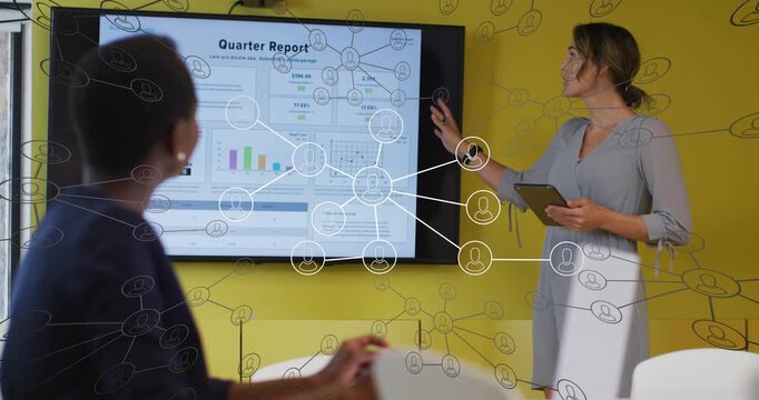 Presenter tapping tablet, pointing at Qtr Report in business review, overlay showing charts on tap